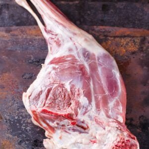 Raw leg of lamb.