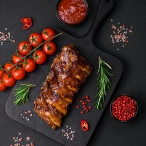 Delicious grilled pork loin ribs with sauce, spices and herbs