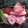 Fresh Raw lamb shanks with herbs and spices, mutton meat.