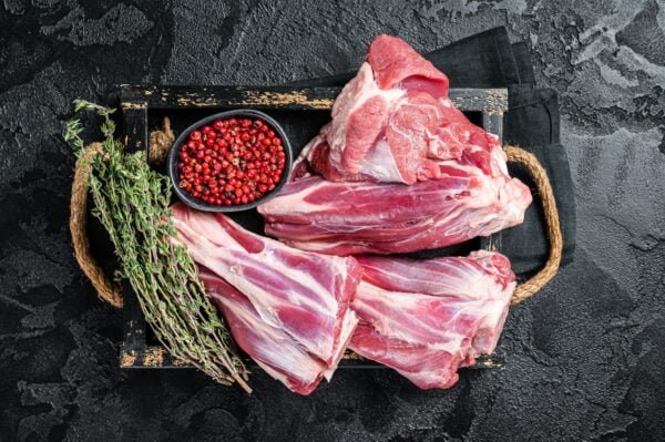 Fresh Raw lamb shanks with herbs and spices, mutton meat.